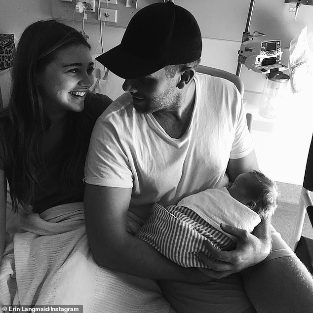 Erin Langmaid and her partner Dan Carty became surprise parents after baby Isla was born on a bathroom floor (Pictured: the young family in hospital)