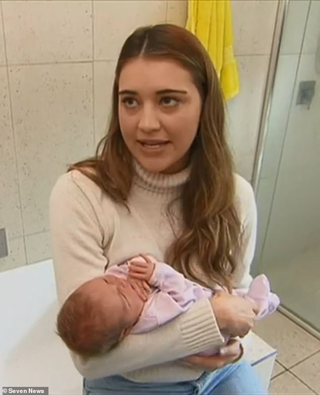 Ms Langmaid (pictured with Isla in the bathroom) described the birth as 