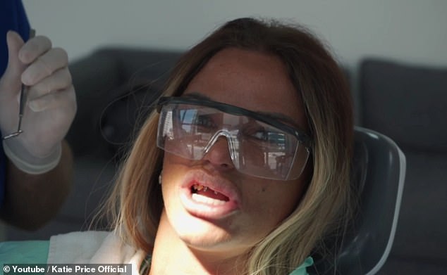 Not so glam: Katie Price joked that she looked like a James Bond villain as she showed off her metal teeth in her latest YouTube video